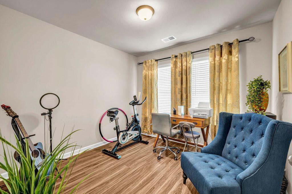 255 Skipjack Court Covington, GA 30016 - Photo 20 of 24 a view of a livingroom with furniture and windows