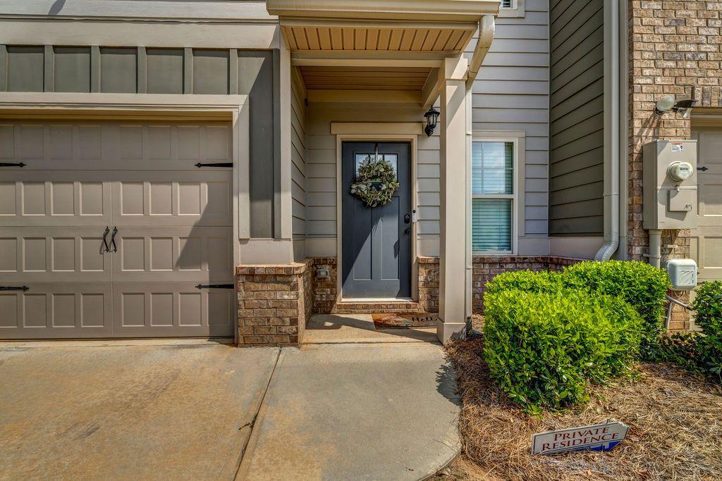 255 Skipjack Court Covington, GA 30016 - Photo 2 of 24 a front view of a house with a garden