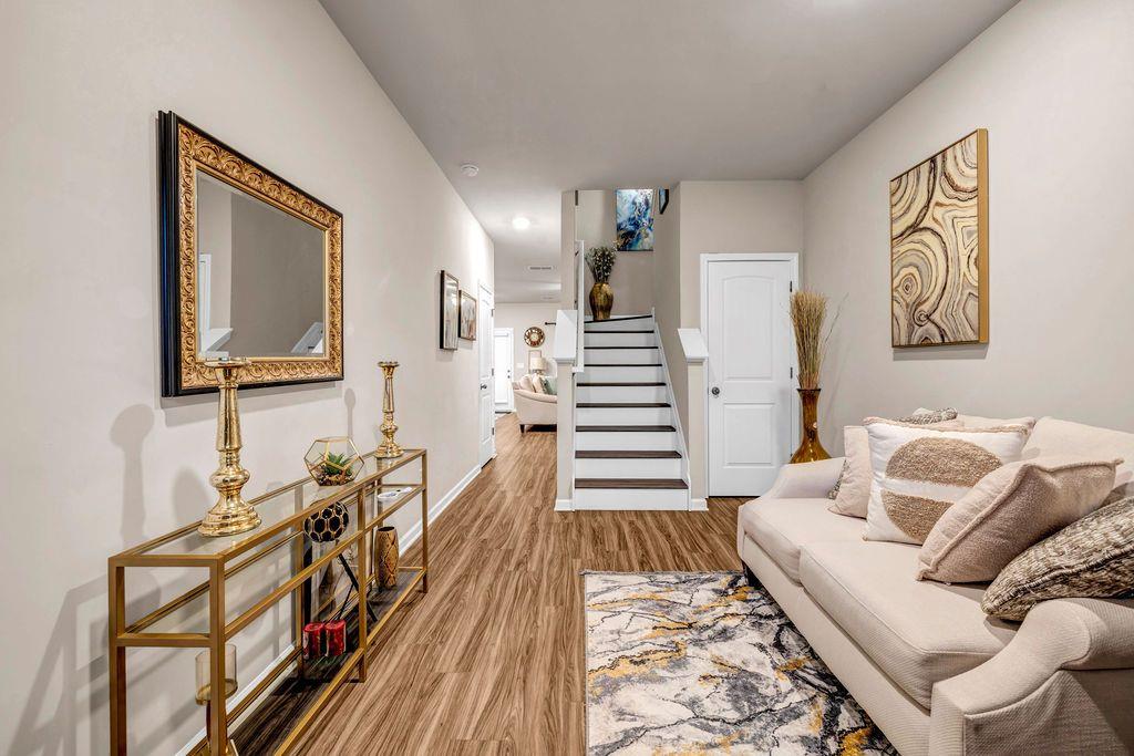 255 Skipjack Court Covington, GA 30016 - Photo 4 of 24 a living room with furniture and wooden floor