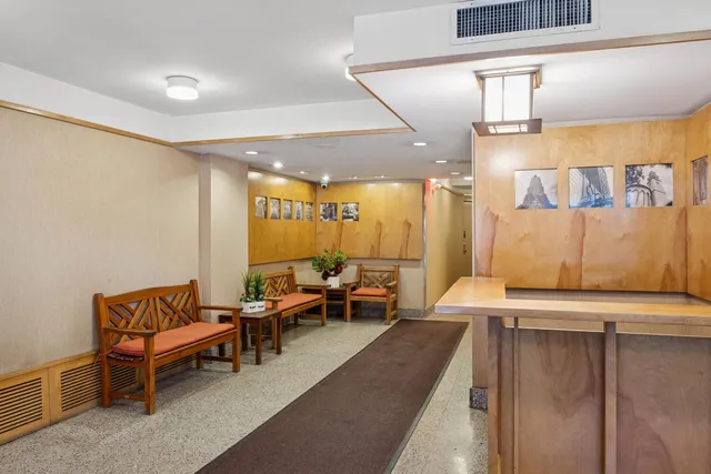 a lobby with furniture and rug