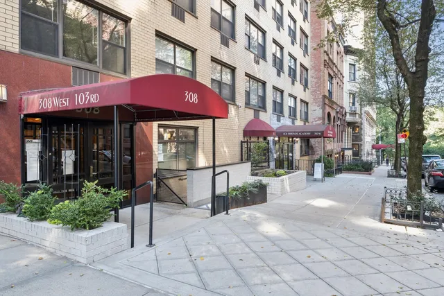 a view of a building with sitting area