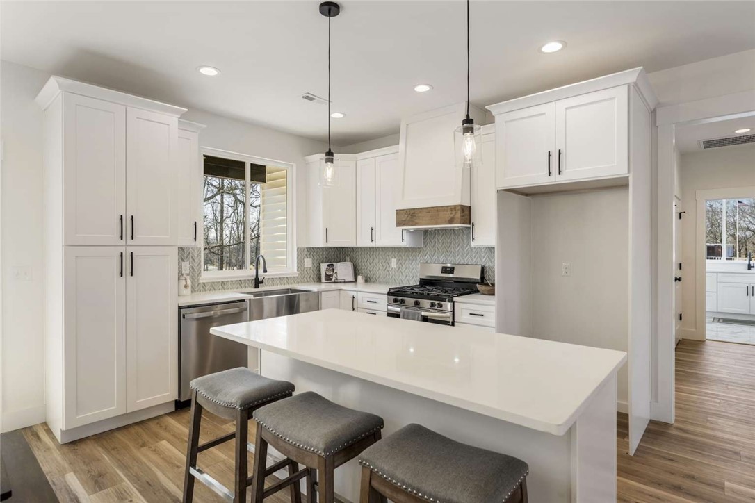 191 Murdock Road Belton, SC 29627 - Photo 7 of 24 This bright kitchen features sleek appliances, ample counter space, and a functional island for casual dining.