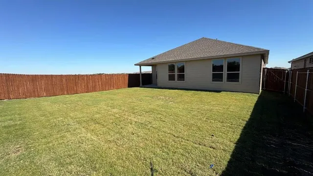 a picture of a bench in front of building