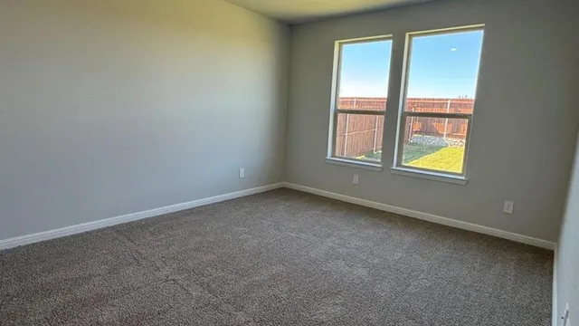 a kitchen with stainless steel appliances granite countertop a stove refrigerator sink and microwave