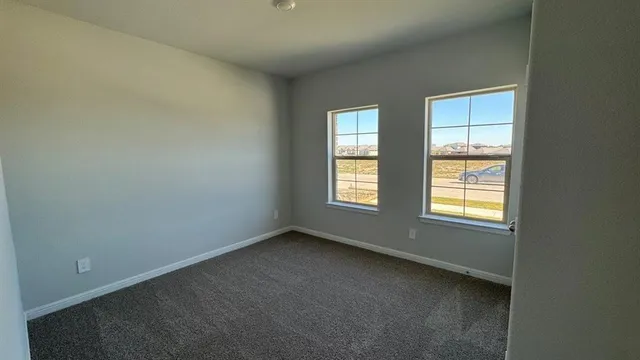 a bathroom with a double vanity sink and mirror