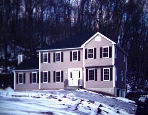 10 Echo Valley Road Newtown, CT 06470 - Photo 1 of 1 a front view of a house with a yard