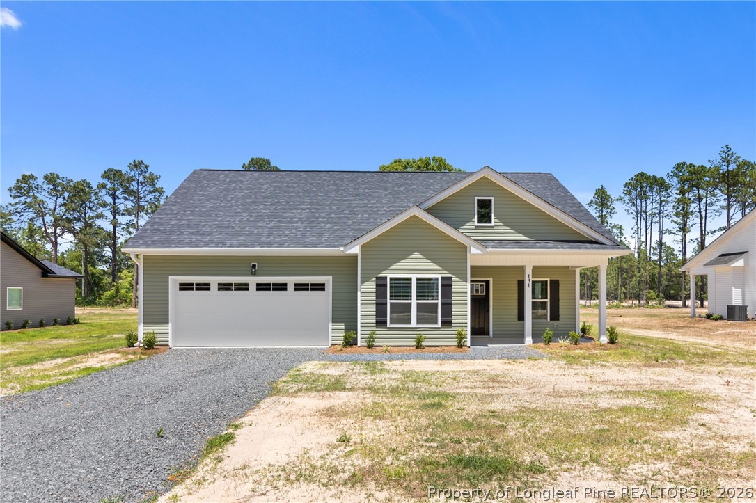 131 Merle Road Pinebluff, NC 28373 - Photo 2 of 33 a front view of a house with a yard