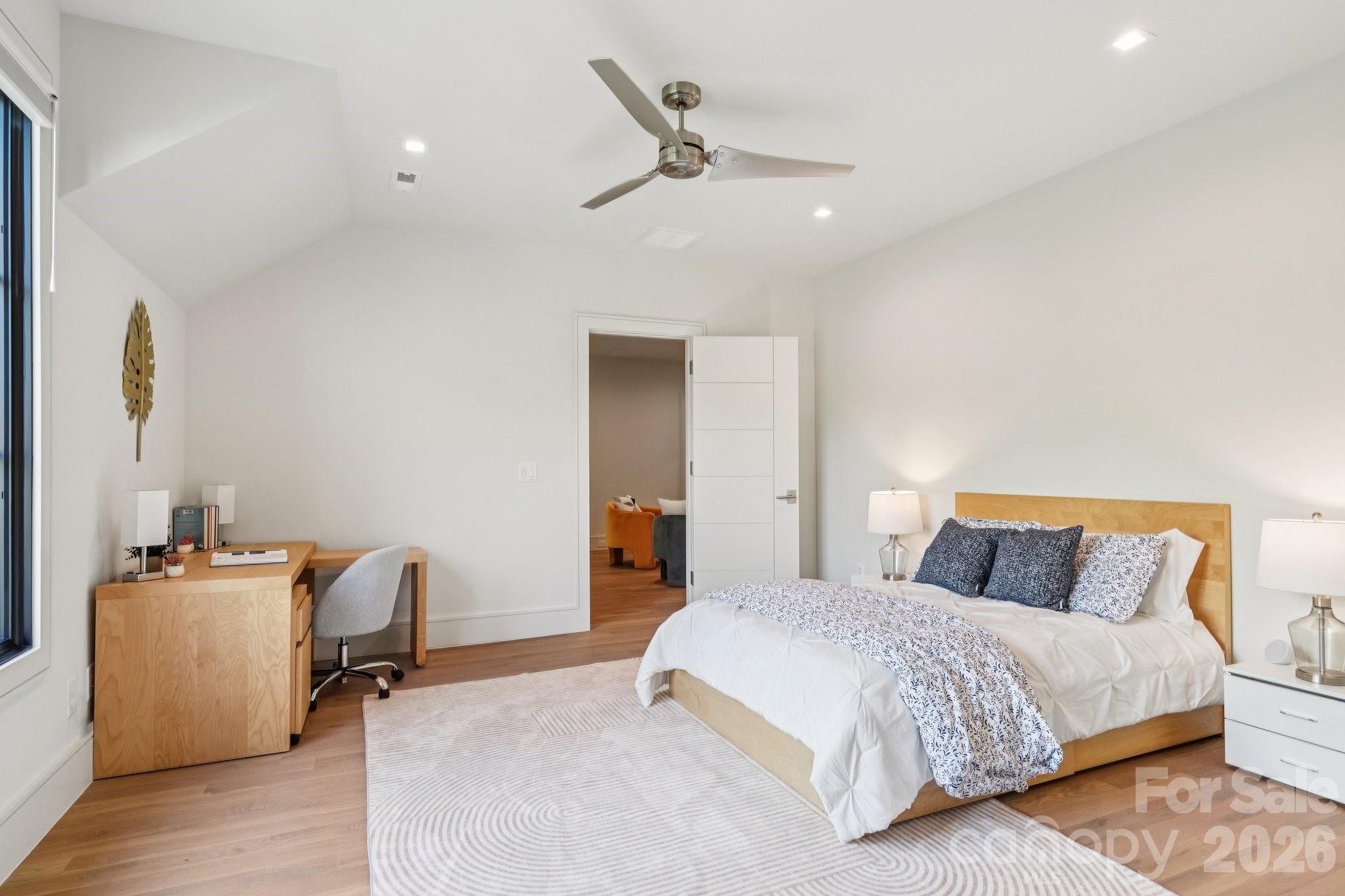 2103 Cortelyou Road Charlotte, NC 28211 - Photo 32 of 45 a bedroom with a bed and a chandelier