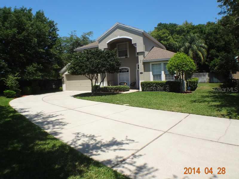 2582 Walnut Heights Road Apopka, FL 32703 - Photo 1 of 1 a front view of a house with a yard