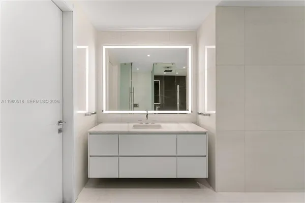 a bathroom with a double vanity sink and mirror