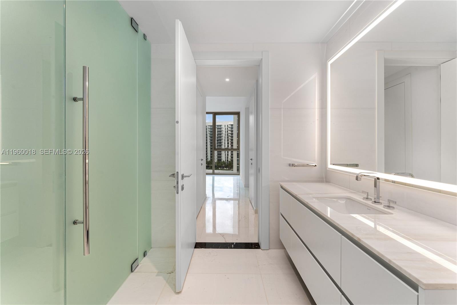 300 Biscayne Blvd Way, Unit 2009 Miami, FL 33131 - Photo 26 of 58 a bathroom with a double vanity sink and mirror