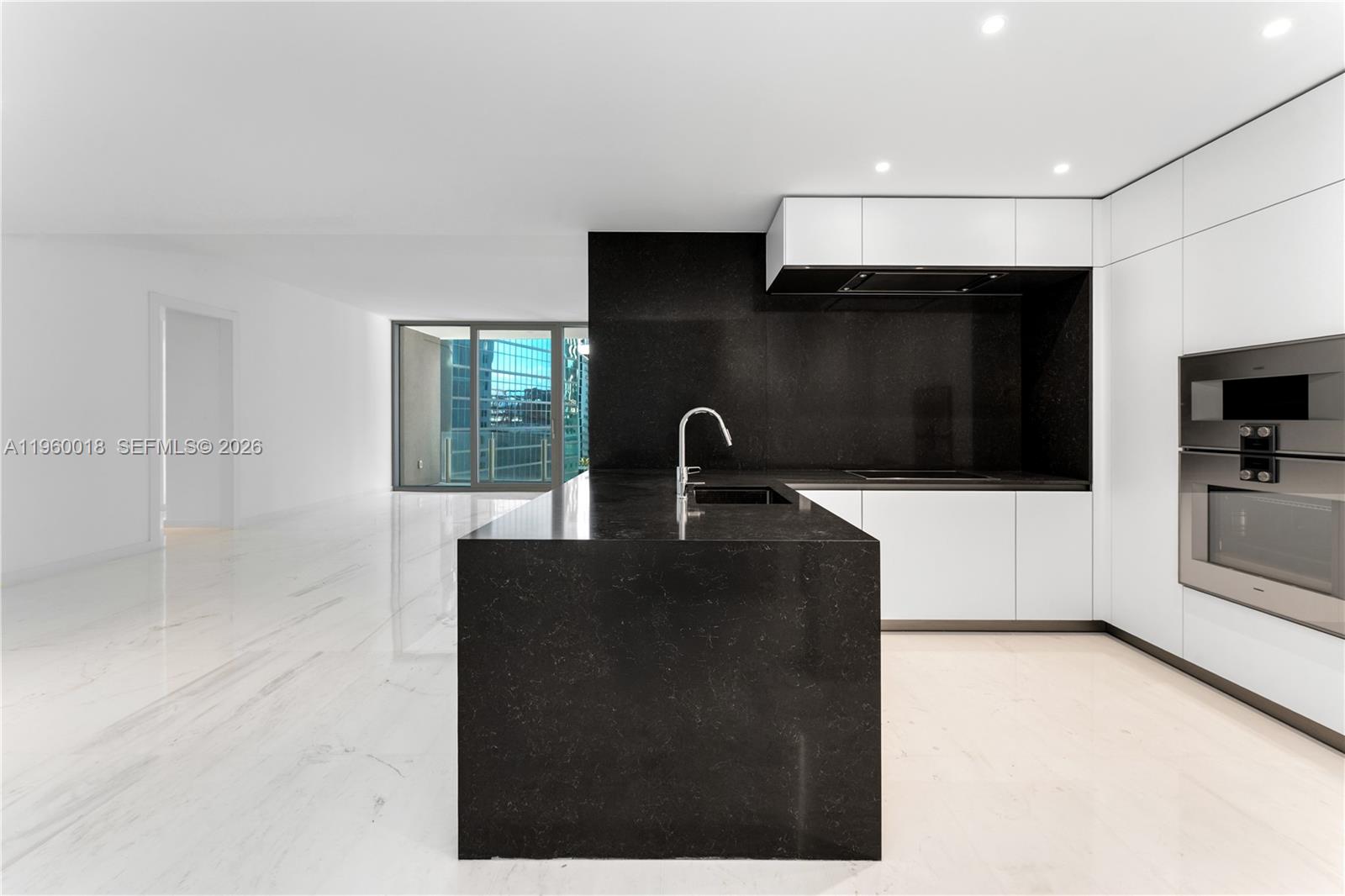 300 Biscayne Blvd Way, Unit 2009 Miami, FL 33131 - Photo 5 of 58 a kitchen with stainless steel appliances a sink stove and microwave