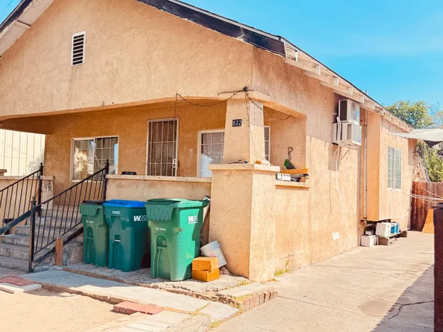 a front view of a house with a backyard