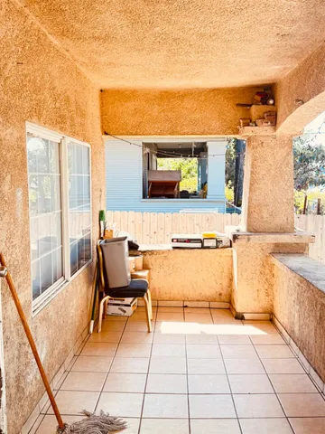 a living room with a large window and a table