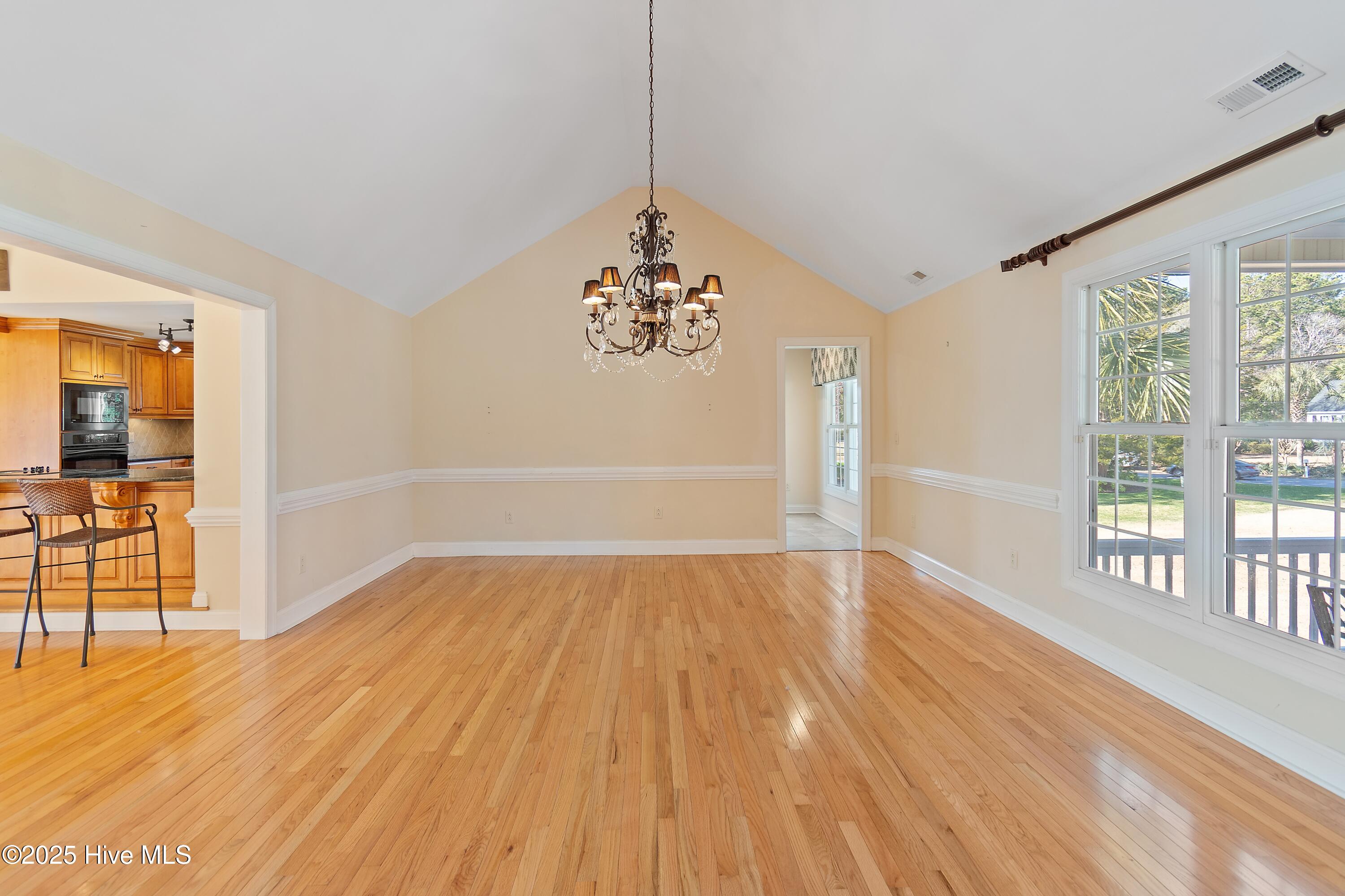 6777 Roberta Road Southwest Ocean Isle Beach, NC 28469 - Photo 12 of 89 Large Dining room with a Stately Chandelier