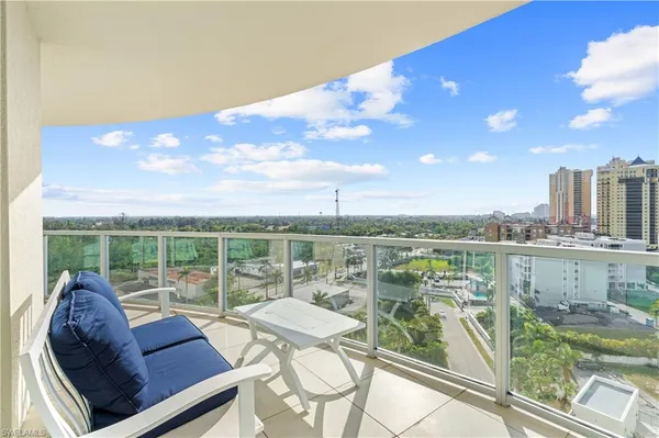 a view of a balcony with lake view and mountain view