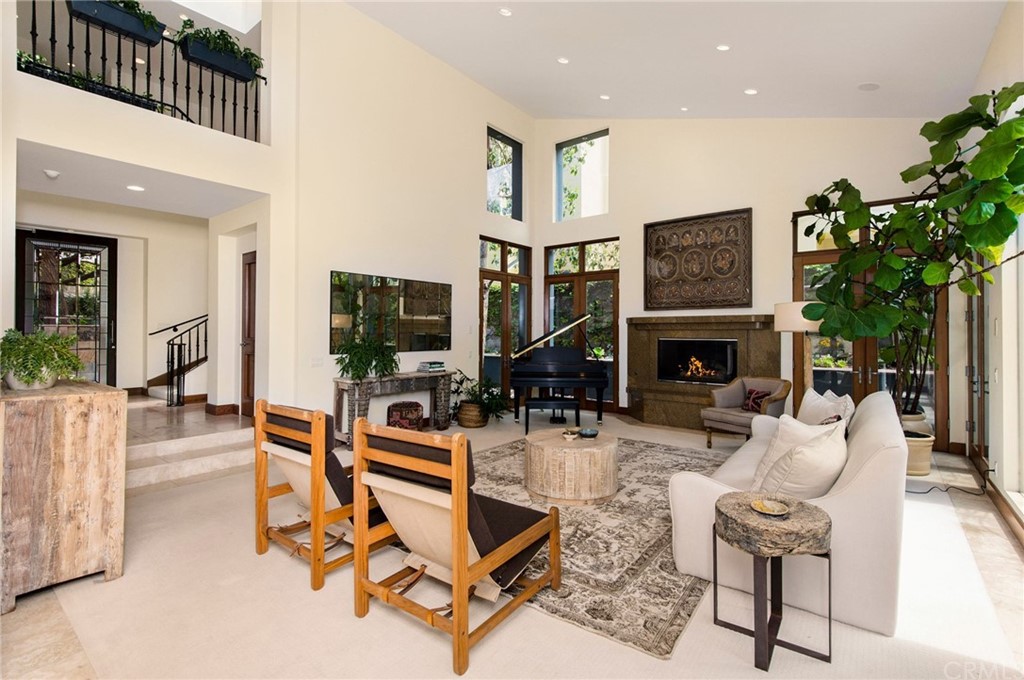 10 Smithcliffs Road Laguna Beach, CA 92651 - Photo 12 of 38 a living room with furniture a flat screen tv and a fireplace
