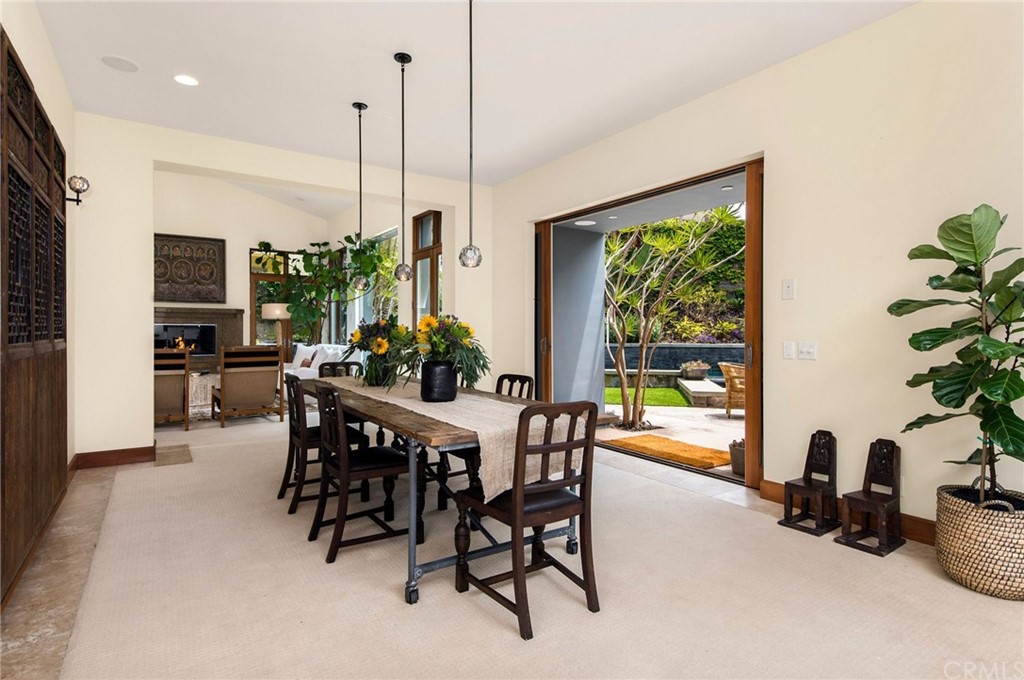 10 Smithcliffs Road Laguna Beach, CA 92651 - Photo 14 of 38 a dining room with furniture water view and a floor to ceiling window