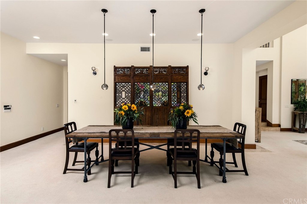 10 Smithcliffs Road Laguna Beach, CA 92651 - Photo 15 of 38 a view of a dining room with furniture one side and wooden floor