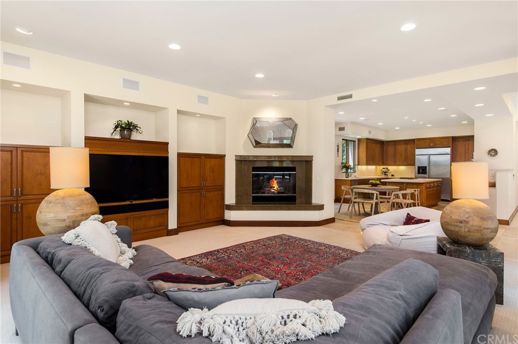 10 Smithcliffs Road Laguna Beach, CA 92651 - Photo 18 of 38 a living room with furniture and a fireplace