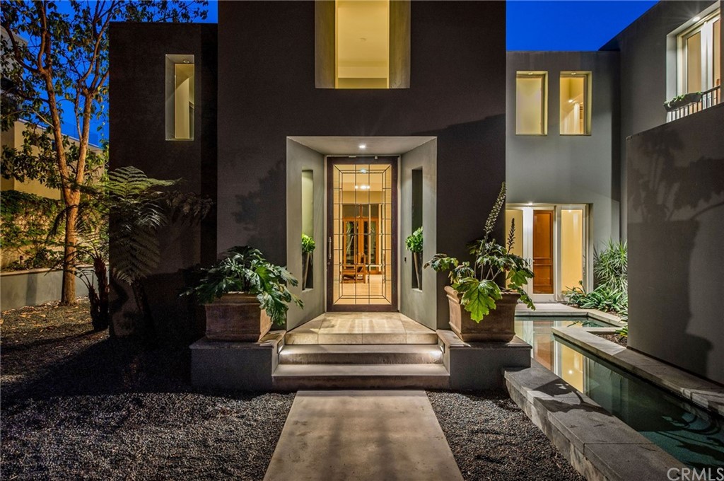 10 Smithcliffs Road Laguna Beach, CA 92651 - Photo 2 of 38 a front view of a house with outdoor seating