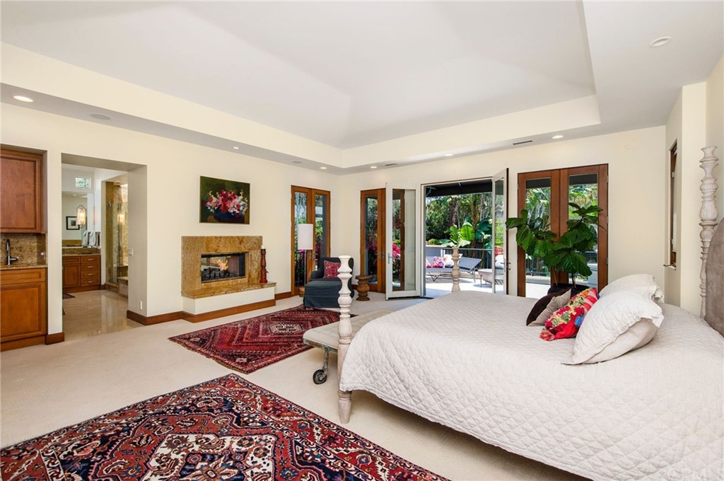 10 Smithcliffs Road Laguna Beach, CA 92651 - Photo 24 of 38 a bedroom with a bed and a large window