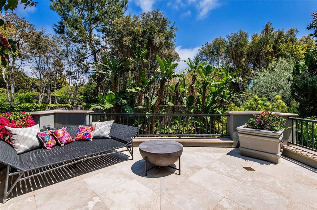 10 Smithcliffs Road Laguna Beach, CA 92651 - Photo 25 of 38 a view of a patio with couches chairs and a potted plant