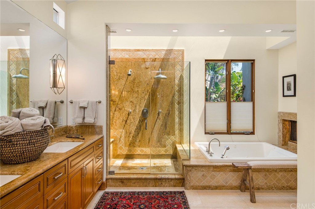 10 Smithcliffs Road Laguna Beach, CA 92651 - Photo 27 of 38 a spacious bathroom with a tub shower and sink