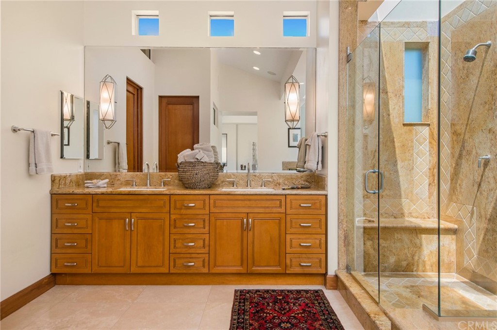 10 Smithcliffs Road Laguna Beach, CA 92651 - Photo 29 of 38 a bathroom with a granite countertop sink and a mirror