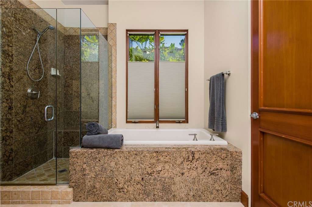 10 Smithcliffs Road Laguna Beach, CA 92651 - Photo 31 of 38 a bathroom with a granite countertop sink and a mirror