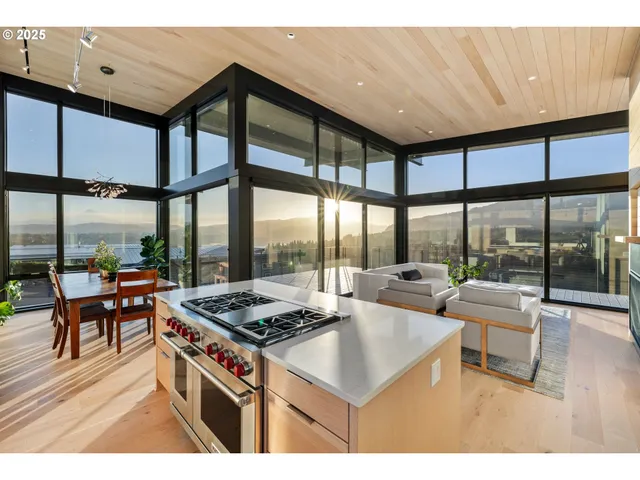 a kitchen with a stove a table and chairs