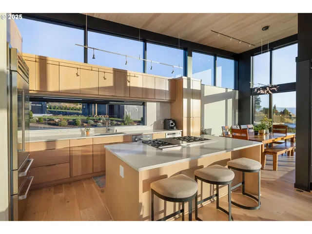 a kitchen with stainless steel appliances granite countertop a sink and cabinets