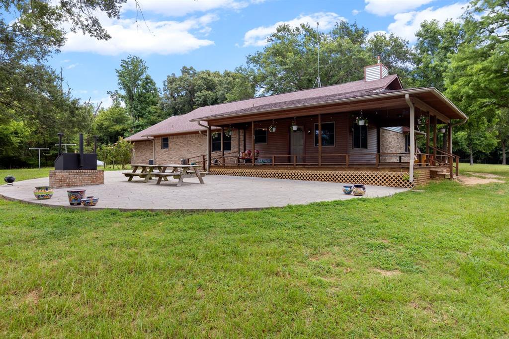 476 Private Road 7326 Emory, TX 75440 - Photo 32 of 33 a view of a house with backyard sitting area and garden