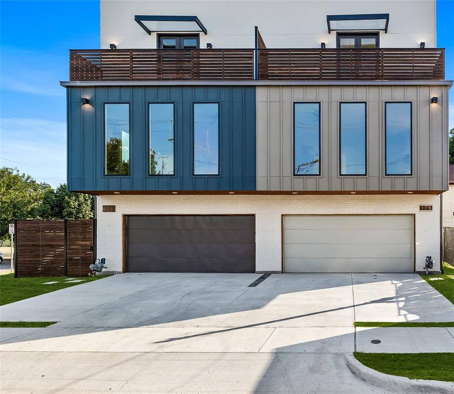 a front view of a house with garage