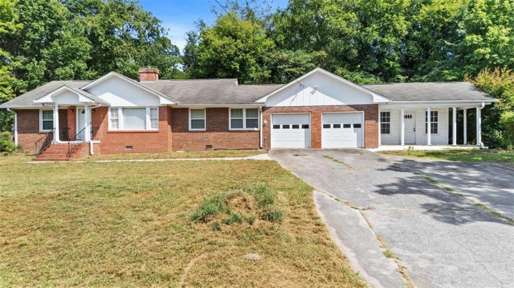 2709 Maple Road Southeast Rome, GA 30161 - Photo 1 of 1 a front view of a house with a yard