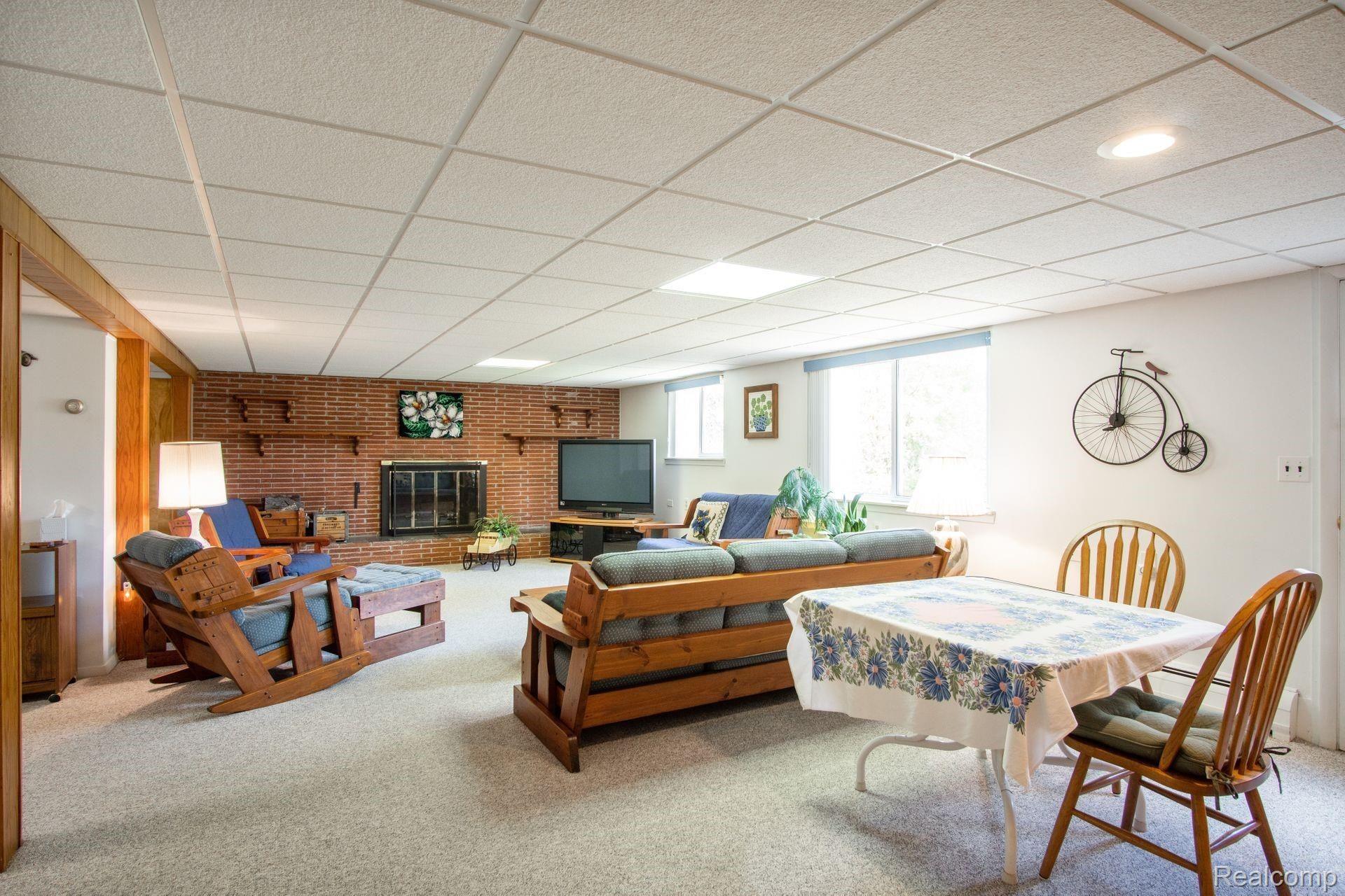 2270 Armond Road Howell, MI 48855 - Photo 21 of 30 Finished basement - large living room with fireplace