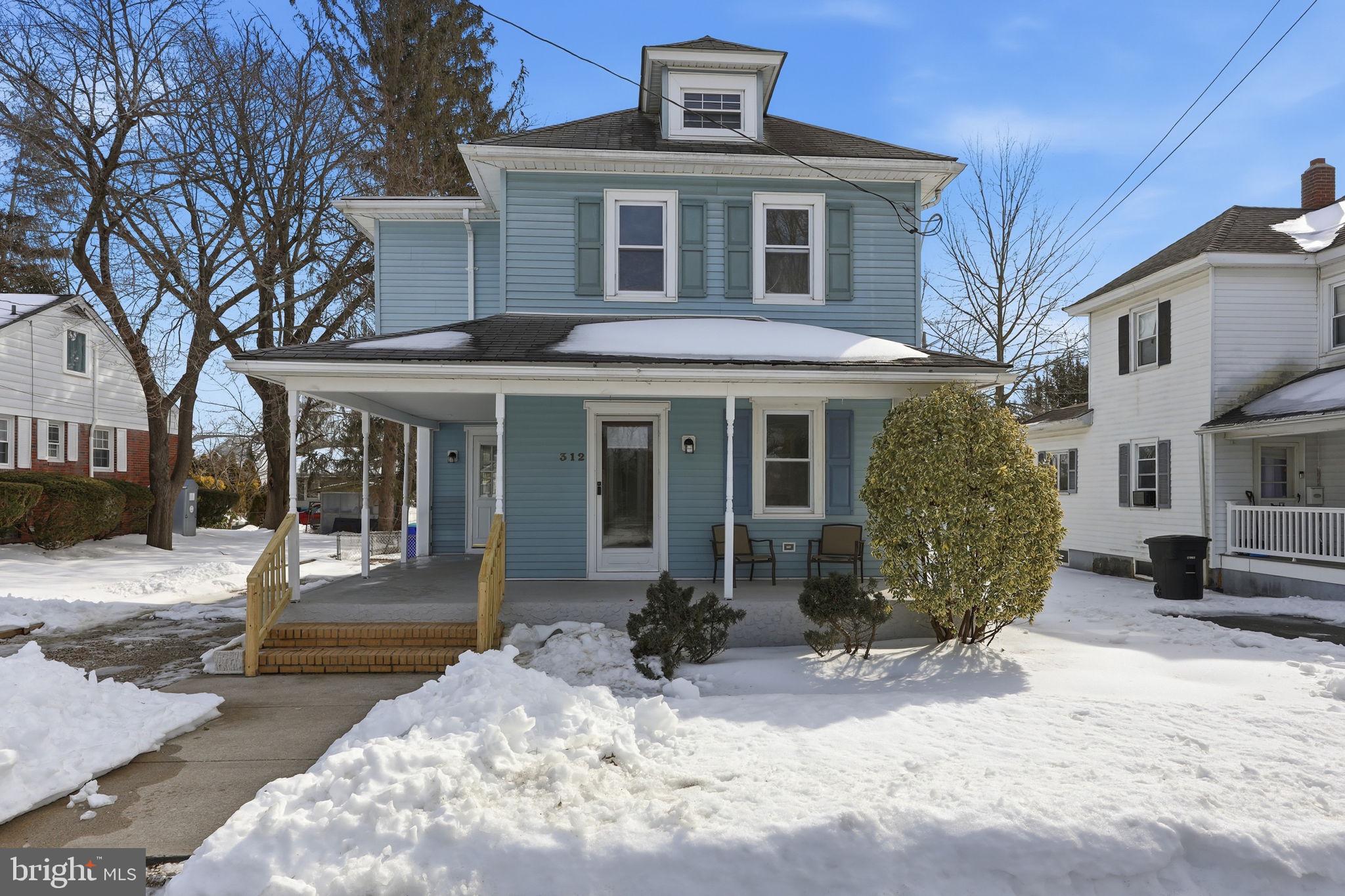 312 Pleasant Street West Hammonton, NJ 08037 - Photo 1 of 64 a front view of a building with a garden