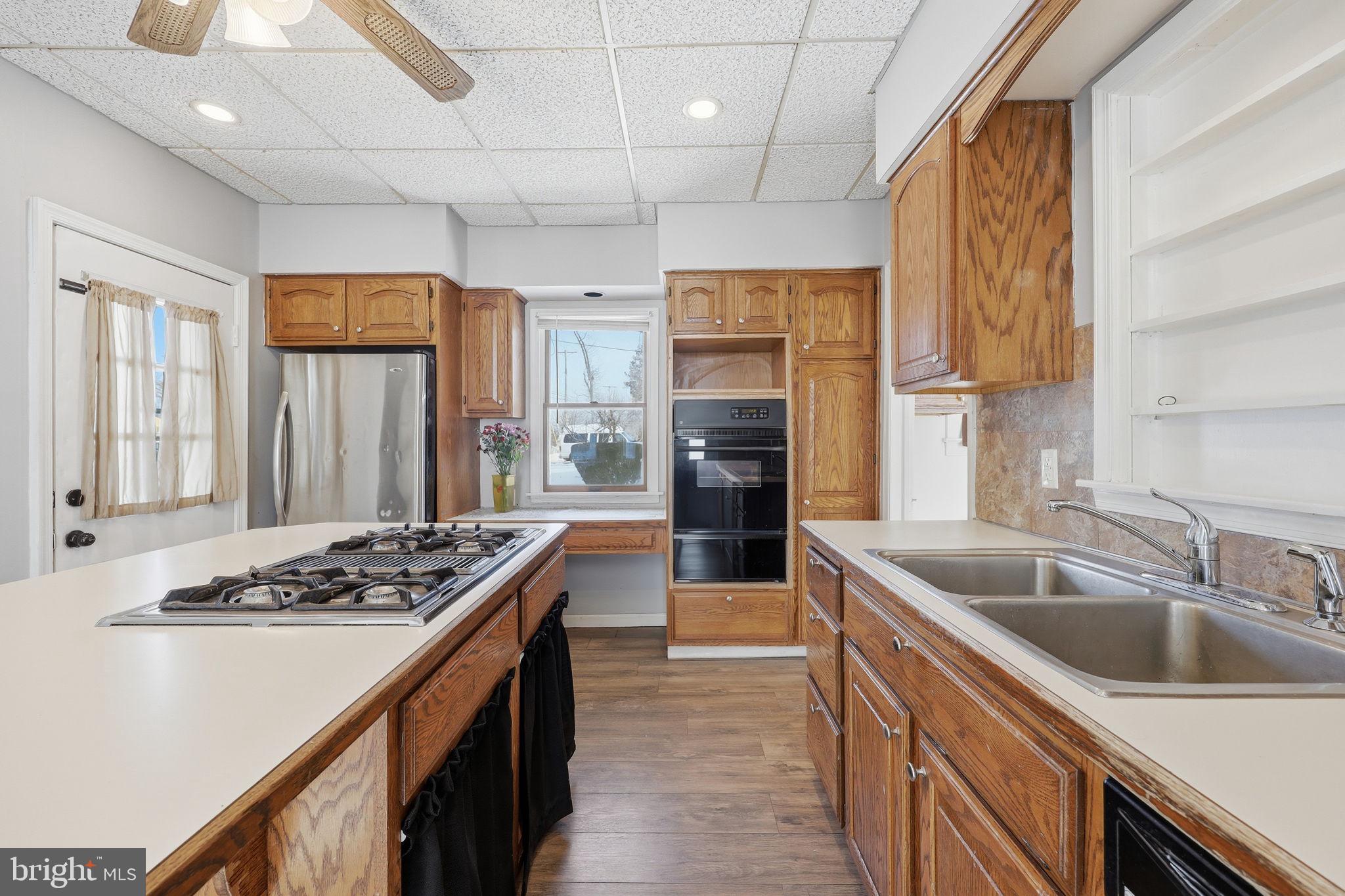 312 Pleasant Street West Hammonton, NJ 08037 - Photo 15 of 64 a kitchen with stainless steel appliances granite countertop a sink stove and refrigerator