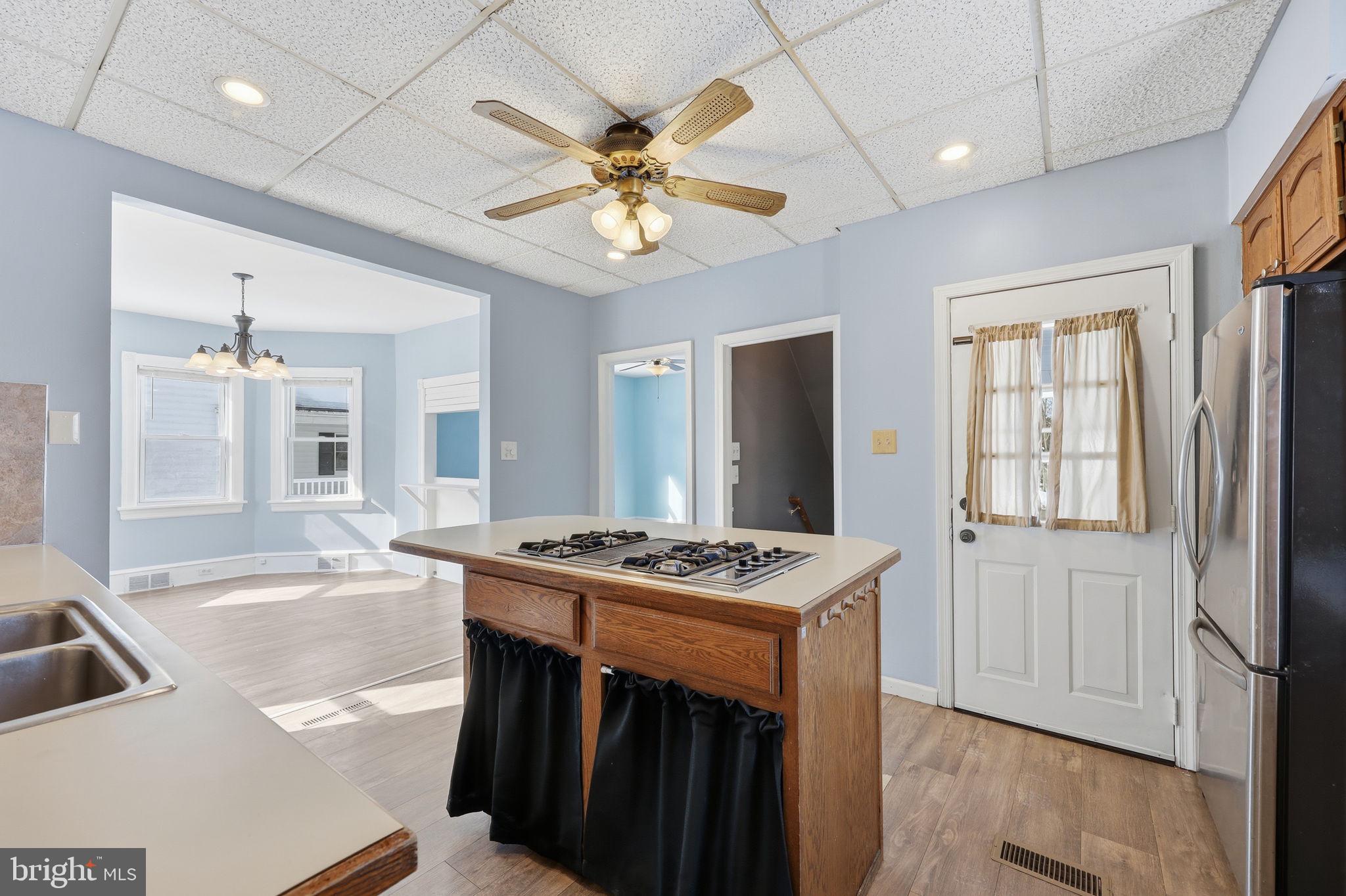 312 Pleasant Street West Hammonton, NJ 08037 - Photo 16 of 64 a open kitchen with stainless steel appliances granite countertop a sink stove and refrigerator