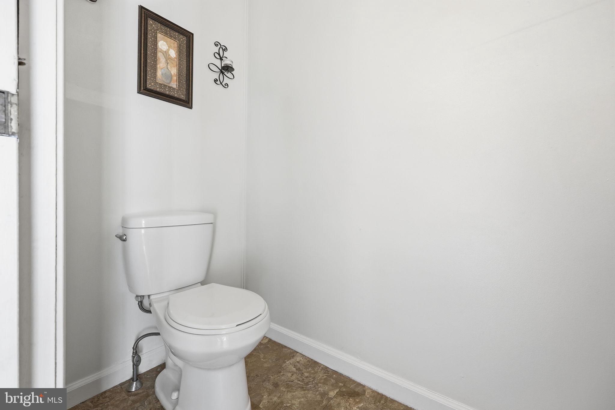 312 Pleasant Street West Hammonton, NJ 08037 - Photo 18 of 64 a white toilet sitting next to a white wall