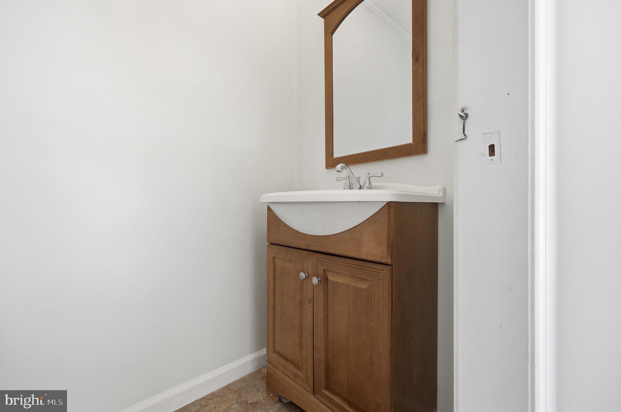 312 Pleasant Street West Hammonton, NJ 08037 - Photo 19 of 64 a bathroom with a sink and a mirror