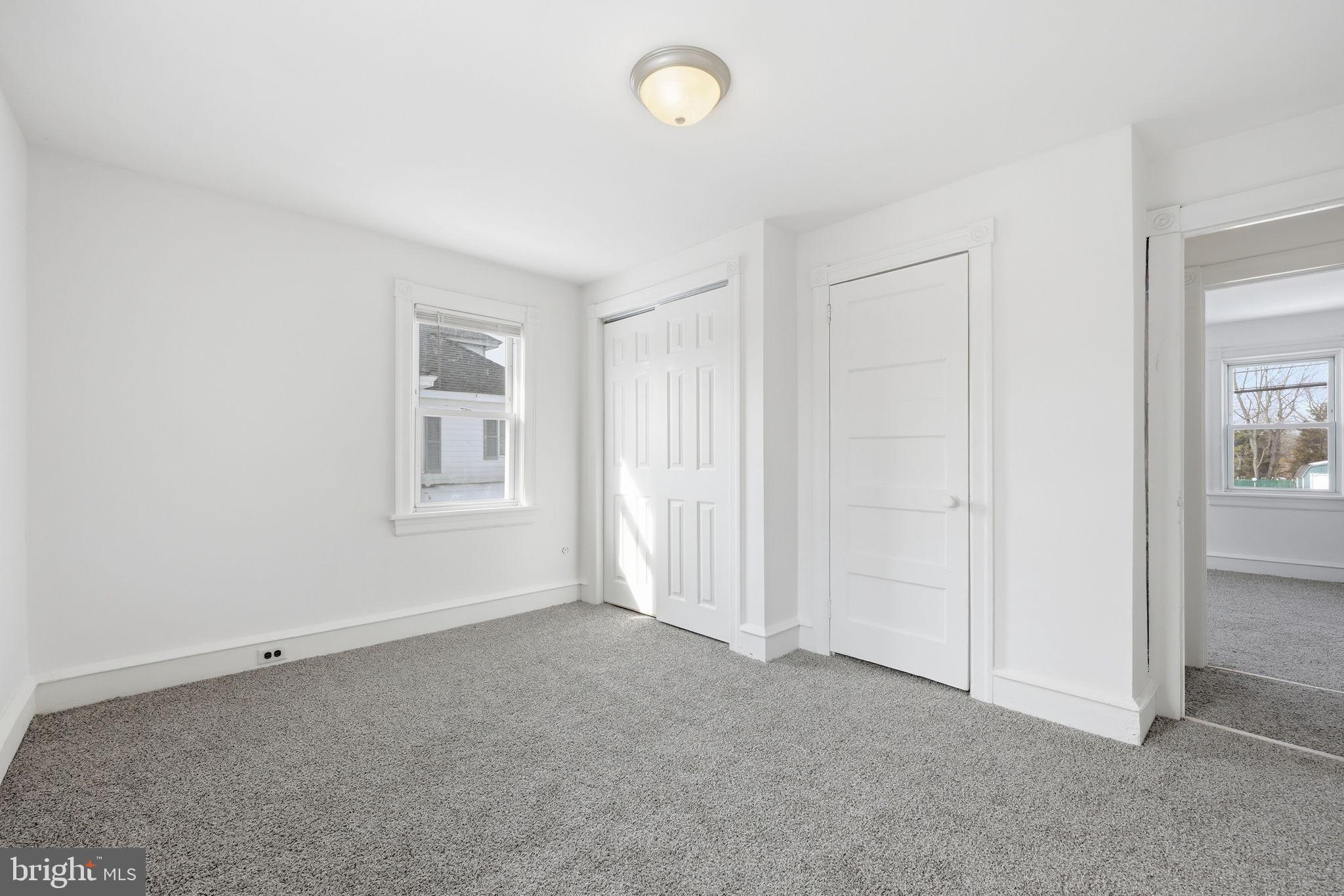 312 Pleasant Street West Hammonton, NJ 08037 - Photo 26 of 64 an empty room with windows and closet