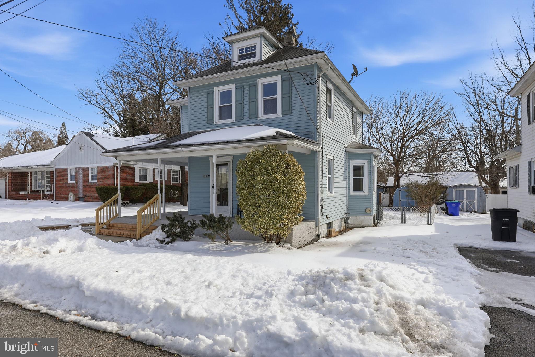 312 Pleasant Street West Hammonton, NJ 08037 - Photo 3 of 64 a front view of a house with a yard covered in snow