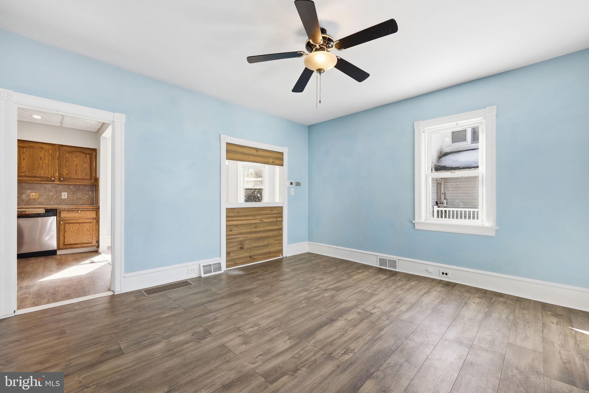 312 Pleasant Street West Hammonton, NJ 08037 - Photo 9 of 64 wooden floor in an empty room with a window