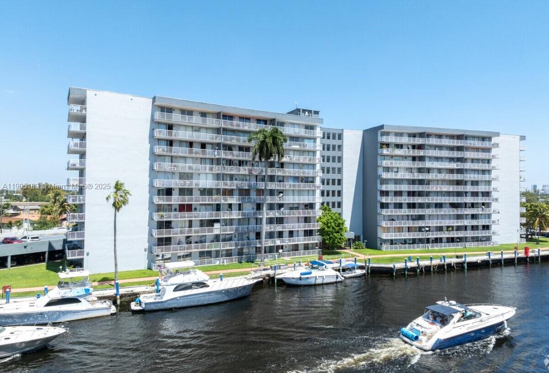 1800 Northwest 24th Avenue, Unit 1019 Miami, FL 33125 - Photo 12 of 14 a view of swimming pool with outdoor seating