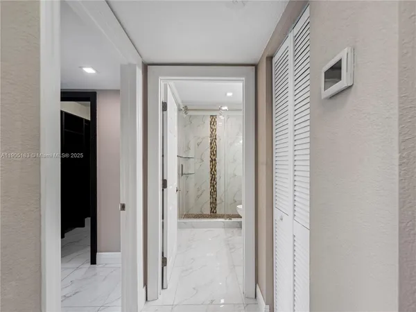 wooden floor with a bathroom