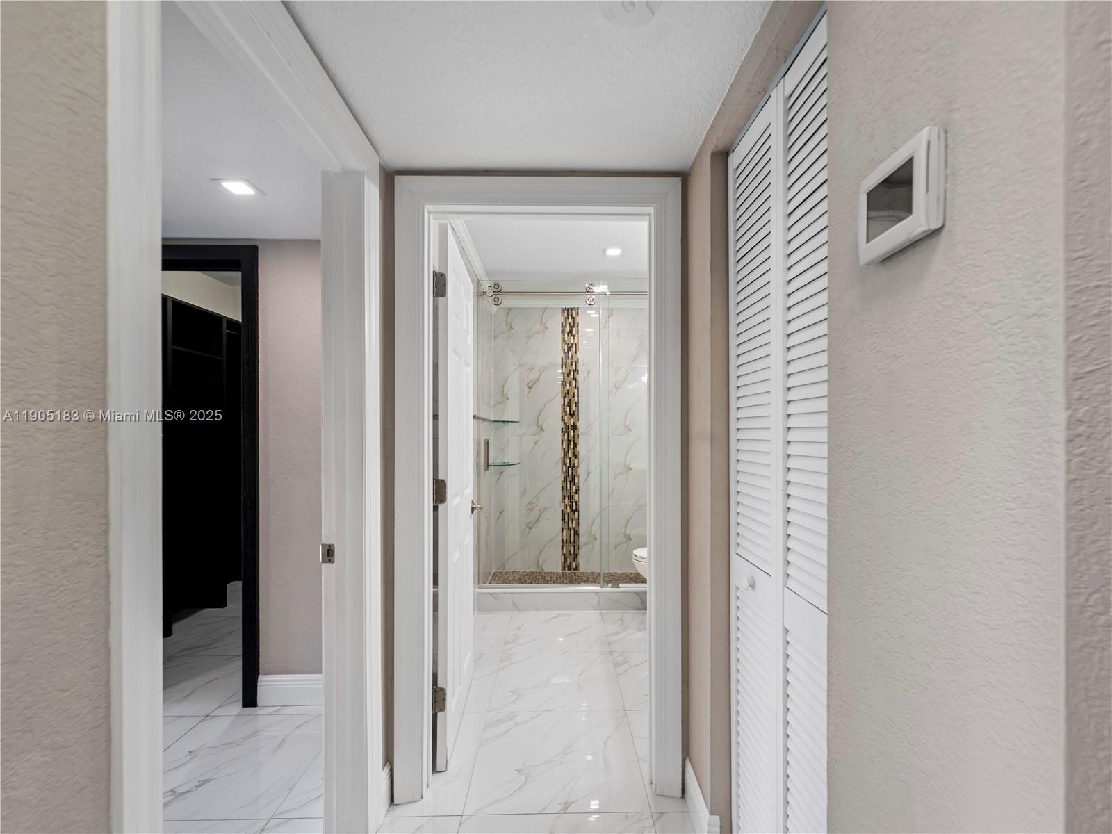 1800 Northwest 24th Avenue, Unit 1019 Miami, FL 33125 - Photo 8 of 14 wooden floor with a bathroom