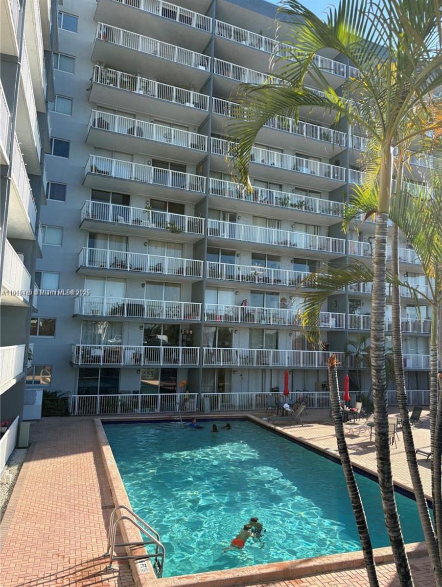 1800 Northwest 24th Avenue, Unit 1019 Miami, FL 33125 - Photo 10 of 14 a view of a tall building from a balcony
