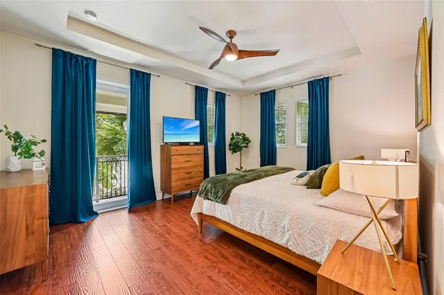 a bedroom with a bed and a potted plant