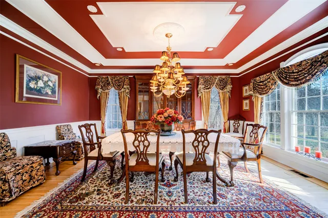 a view of a dining room with furniture and window